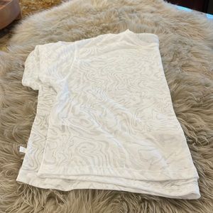 Lululemon Women’s Sheer T-Shirt. Size 10 no tags. White print.